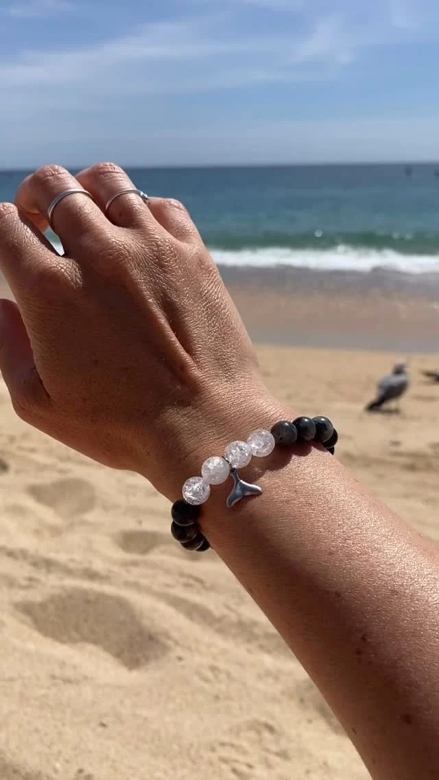The Orca Bracelet - Obsidian, Labradorite & Crystal Quartz natural gemstones with a stainless steel whale tail charm. 🐳 ✔️ www.ORCALEGACY.com #orca #orcalegacy #whaletail #oceanjewelry #beach #beachlife #killerwhale